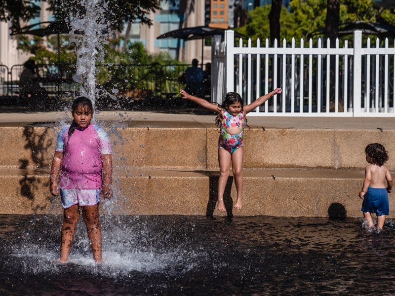 Kids play in the water at Waterfront Park on Aug. 28, 2023.