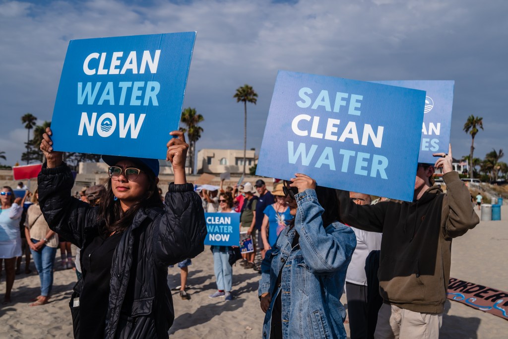 Protesters gathered for 'Stop The Sewage' rally at Central Beach in Coronado on Sept. 1, 2023.