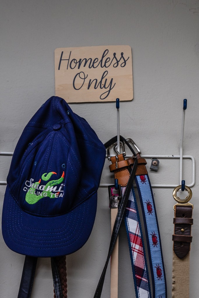 Donated belts and a hat hang at The Brother Benno Foundation in Oceanside on Sept. 20, 2023.