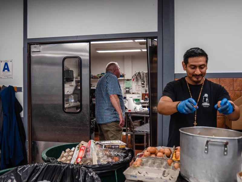 Oscar Rodriguez a volunteer in the recovery program works in the kitchen at The Brother Benno Foundation in Oceanside on Sept. 20, 2023.