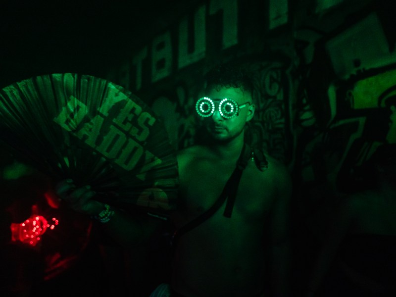 A man holds a fan in the underground tunnel on Oct. 21, 2023.