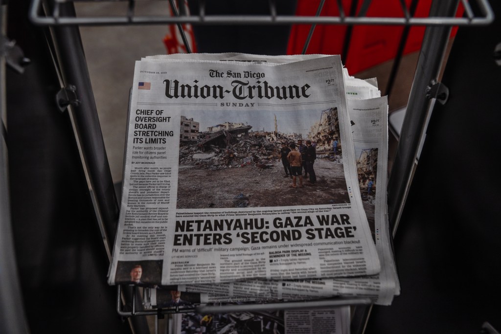 Copies of The San Diego Union-Tribune on a stand at Albertson's in the East Village on Oct. 29, 2023.