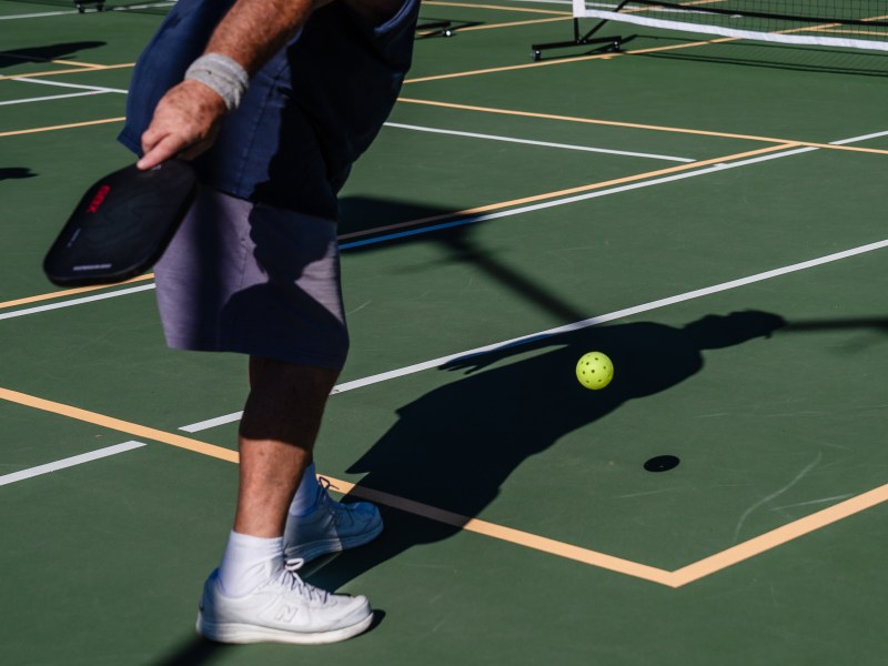 A man plays pickleball at San Diego Pickelball at the Mission Bay Resort On Nov. 28, 2023.