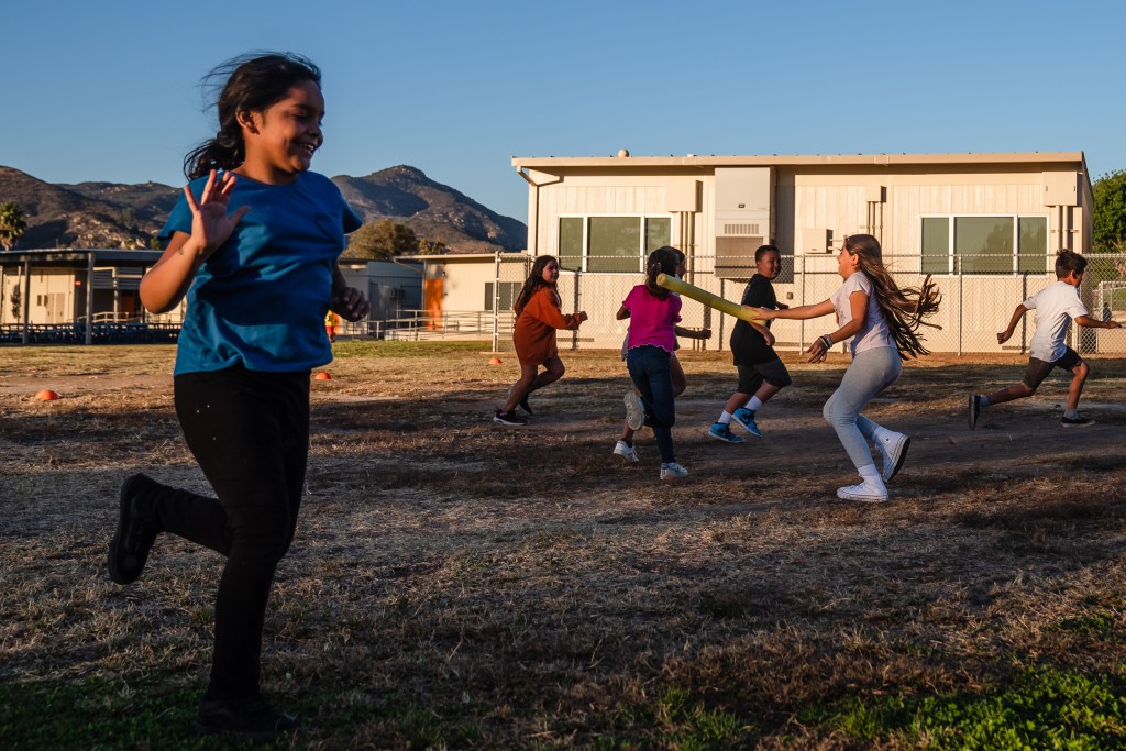 Children play outside at Glen Elementary during a YMCA after-school program in Escondido on Nov. 6, 2023.