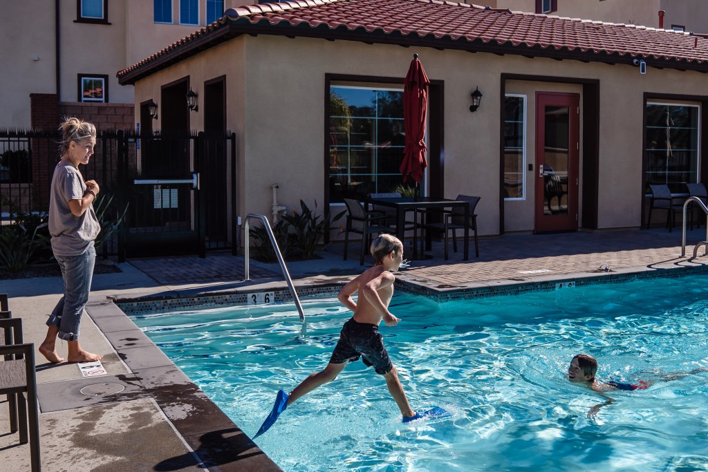 Sara Shields takes a pool break with her sons Graeson, 12 and Owen, 7 in Vista on Dec. 5, 2023.