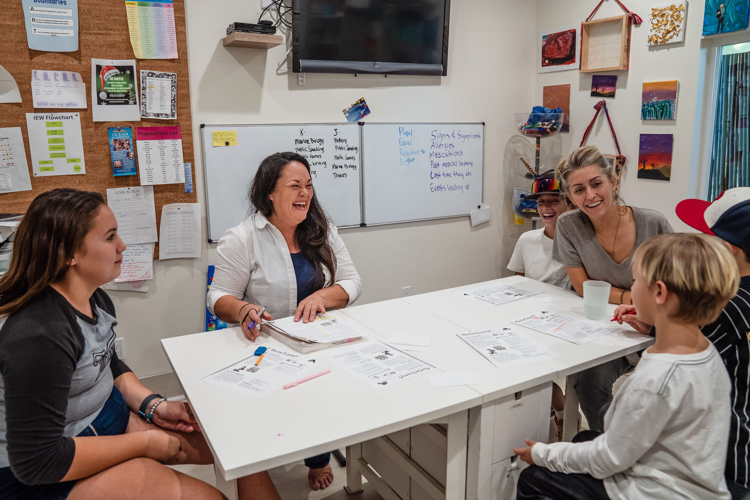 Sara Shields with her son Graeson, 12, Owen Shields, 7, Jax Loy, 9 and his sister Keilani Loy, 12, during a Virtues and Detachment lesson that Suzette Loy is teaching in Vista on Dec. 5, 2023.
