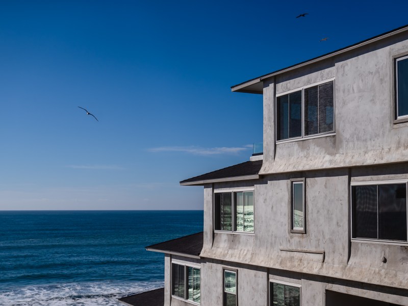 A residential building in front of the beach in Carlsbad on Jan. 2, 2024.