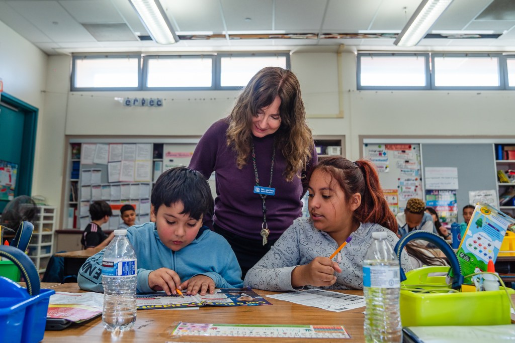 Third grade teacher Therese Leclerc with her students at Edison Elementary School in City Heights on Feb. 15, 2024. / Ariana Drehsler for Voice of San Diego