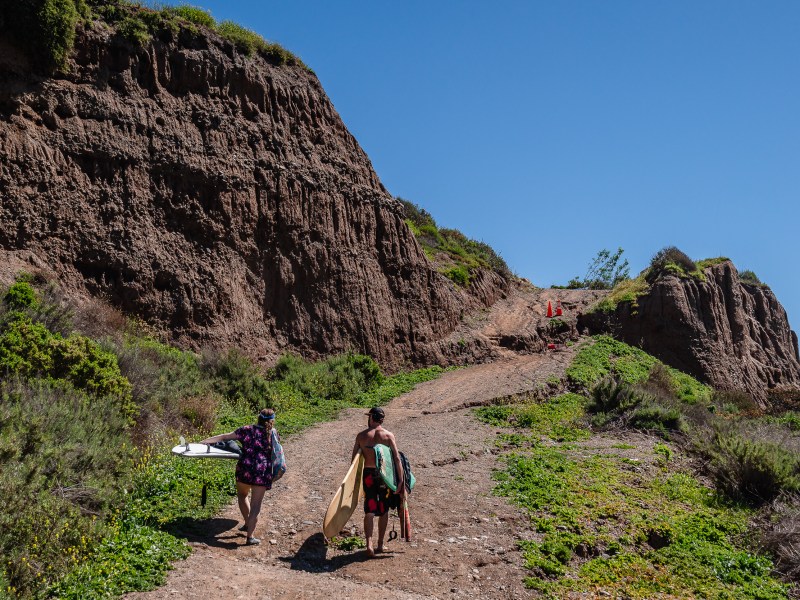 Surfers at San Onofre State Beach, 3 miles south of San Clemente on March 19, 2024. / Photo by Ariana Drehsler for Voice of San Diego