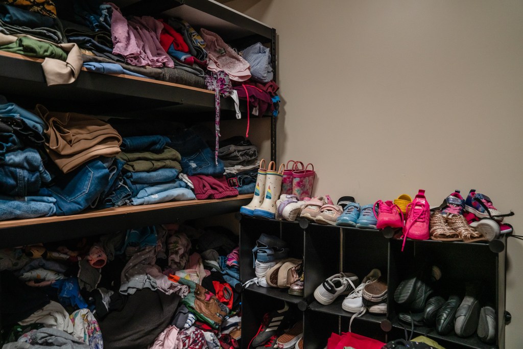 A closet with donated and bought items at Interfaith’s Hawthorne Veteran and Family Resource Center in Escondido on Thursday, Aug. 1, 2024. / Ariana Drehsler for Voice of San Diego