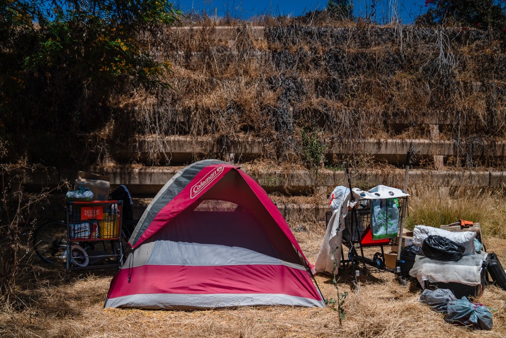 Tommy Rodgers’ tent at a homeless encampment in Lemon Grove on July 31, 2024, where he’s been staying for a month. Rodgers from El Cajon lost his home in 2009. / Ariana Drehsler for Voice of San Diego