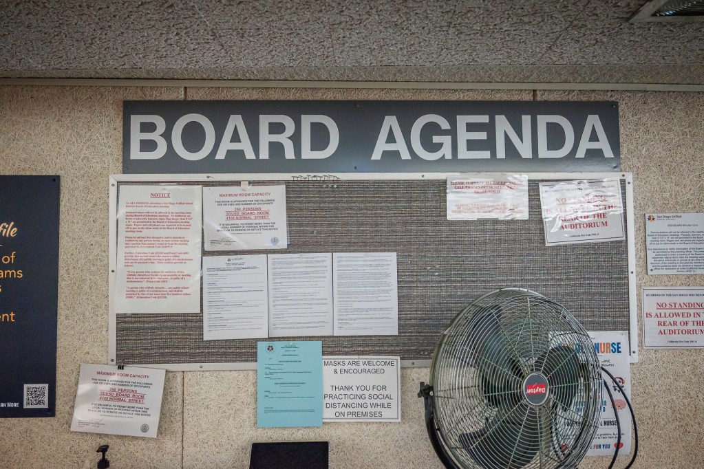 A bulletin board at the San Diego Unified School District Board of Education's Eugene Brucker Education Center Auditorium in San Diego on Tuesday, Sept. 10, 2024. / Photo by Vito di Stefano for Voice of San Diego