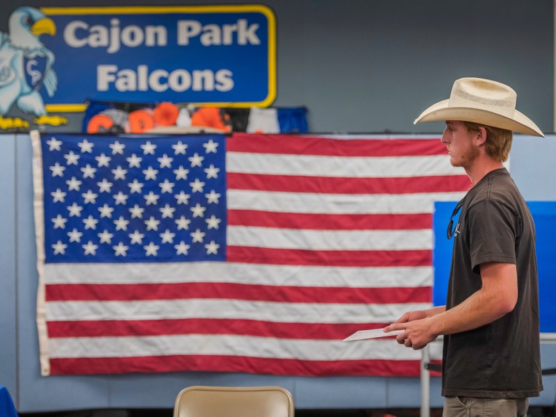 A man wearing a cow boy hat waits in line at the Cajon Park School in Santee on Tuesday, Nov. 5, 2024. / Photo by Vito di Stefano