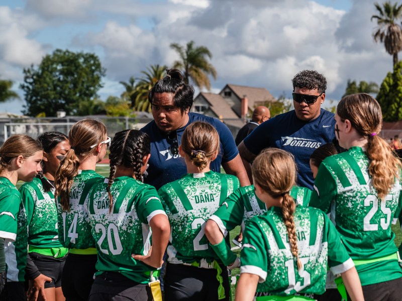 Students from Dana Middle School during a flag football game at Herbert Hoover High School in City Heights on April 26, 2025. / Ariana Drehsler for Voice of San Diego