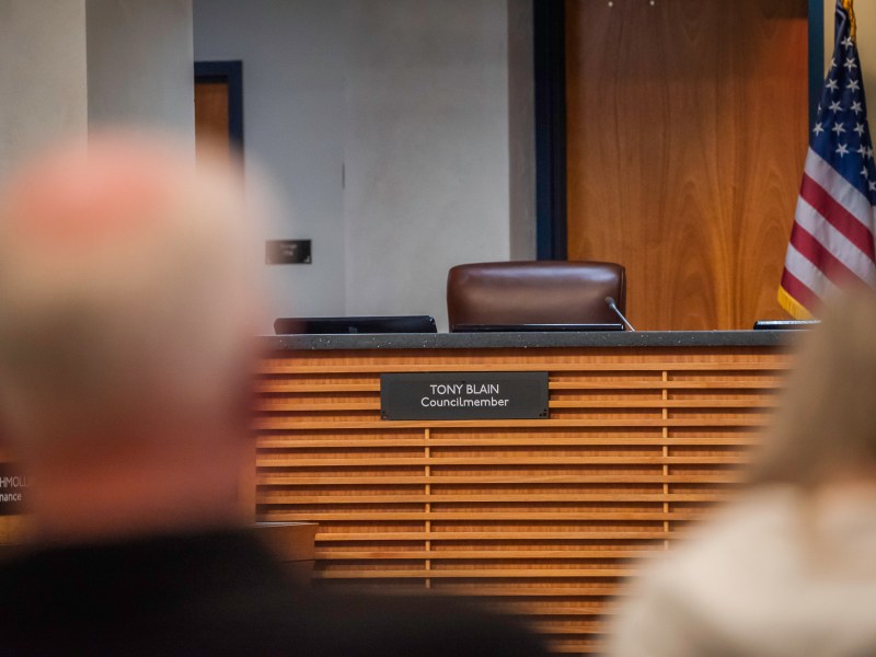 Councilmember Tony Blain's empty chair at the Robert C. Emery City Council Chambers building in Poway April 15, 2025. Councilmember Blain attended the City Council meeting from another location. / Vito di Stefano for Voice of San Diego