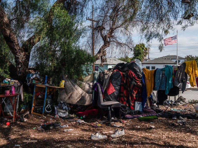 A homeless encampment next to state Route 94 East freeway in Golden HIll on July 15, 2025. / Ariana Drehsler for Voice of San Diego