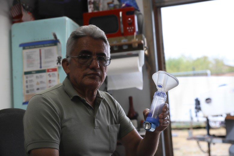 Gregory Montoya, a Beta Street flood survivor, holds his inhaler. / Rami Alarian
