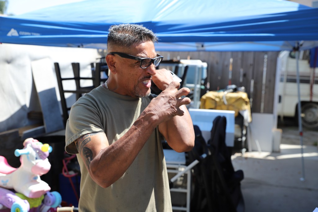 Edgardo Menjivar, a flood survivor, describes an infection that sprouted on his forearm after the flood. / Rami Alarian