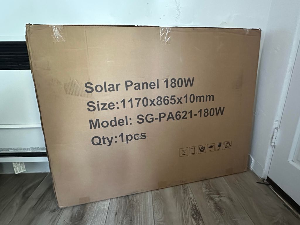 An unboxed 180-watt solar panel lent to a reporter by Bright Saver as part of a plug-in system. / MacKenzie Elmer